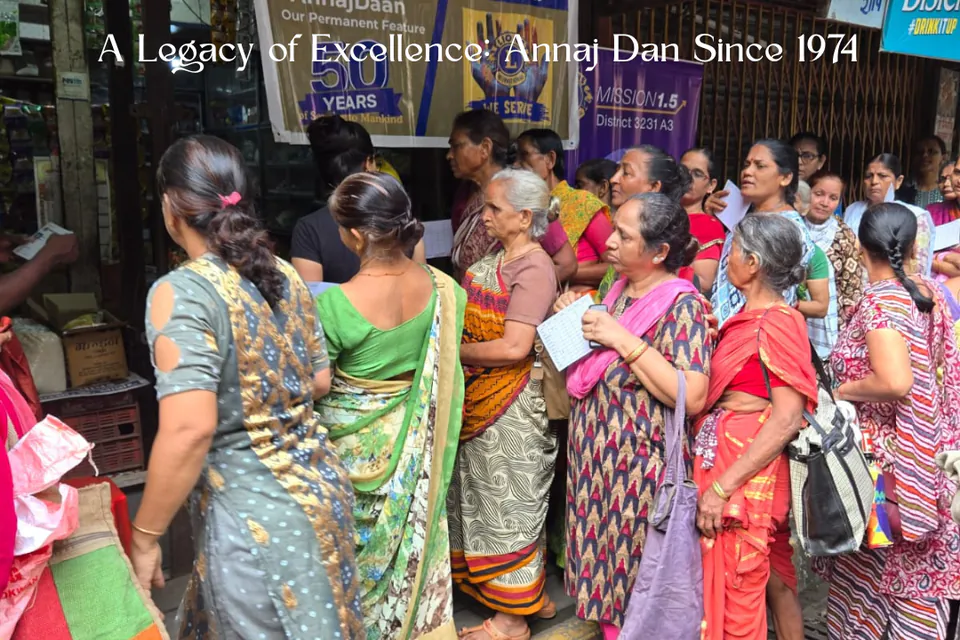 A Legacy of Excellence: Annaj Dan Since 1974. Community members at the club's grain distribution project.